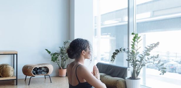 Wide shot of a peaceful exercise studio with large windows
